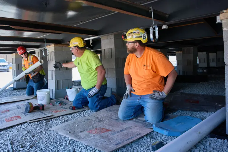 Construction Workers Under Structure