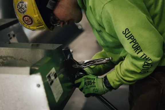 Tradesperson Working with Metal