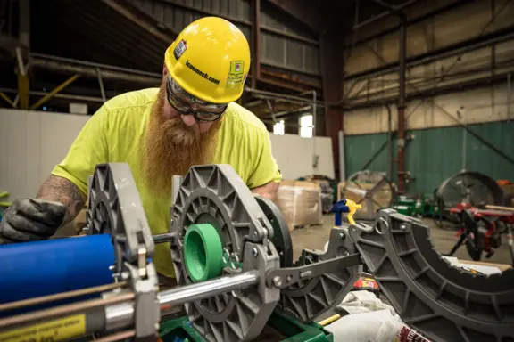 Industrial Worker Operating Pipe Fusion Machine