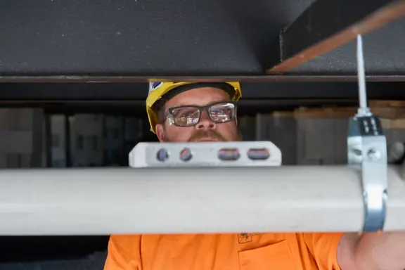 Worker Leveling Pipe
