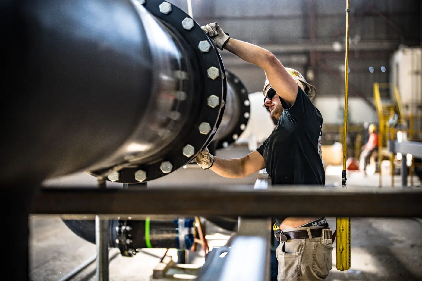Industrial Pipe Assembly Worker