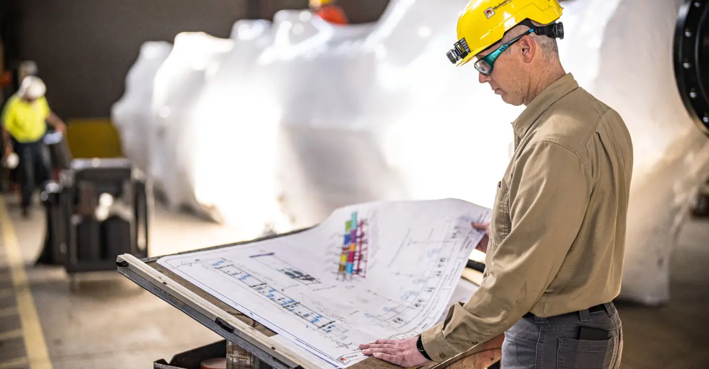 Industrial Engineer Reviewing Blueprints